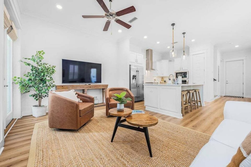Living room space with ample seating to share in television viewing, game nights, and good conversation.