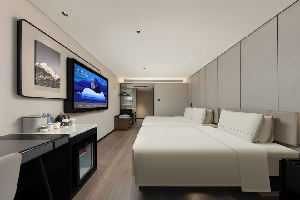 Family Triple Room, City View | Down comforters, pillowtop beds, individually decorated