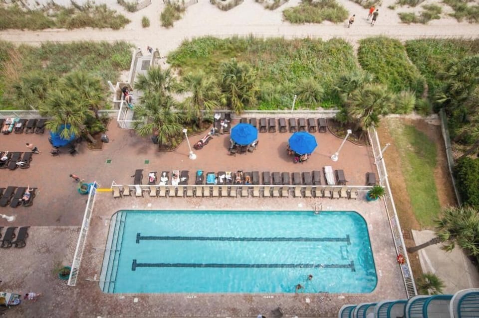 Resort-style pool overlooking the ocean—your everyday escape.