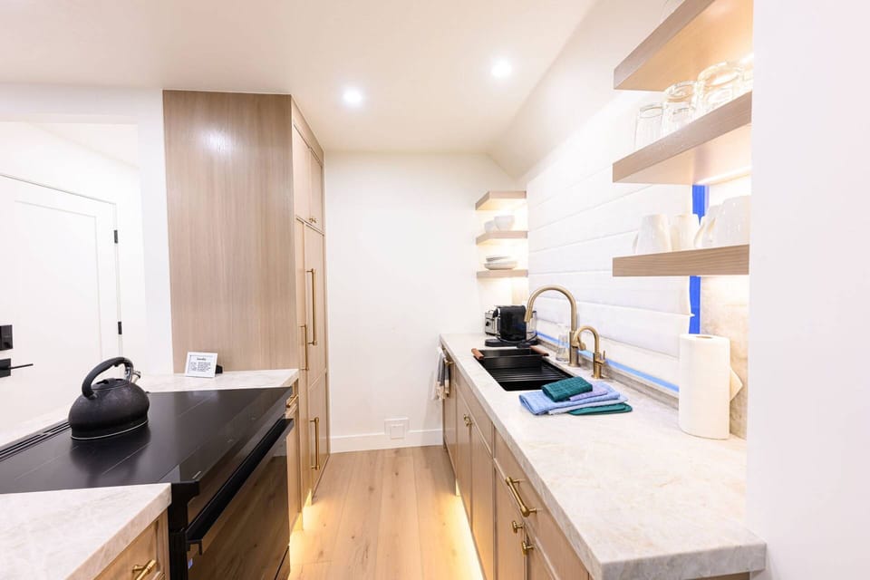 Kitchen with full-size appliances and counter space for meal preparation.