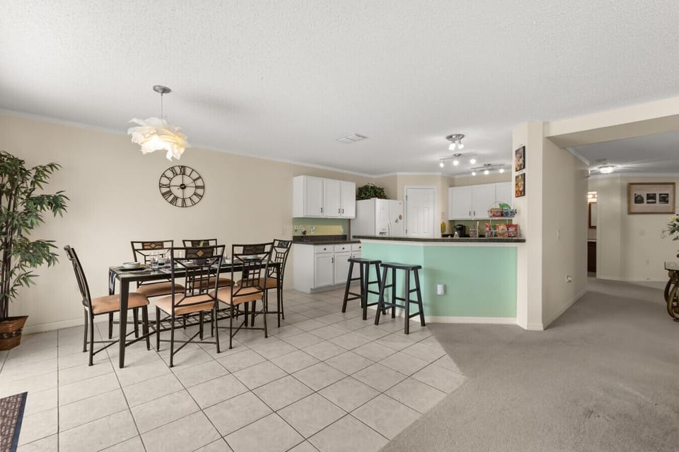 Enjoy home-cooked meals and family time in this bright, open kitchen and dining space.