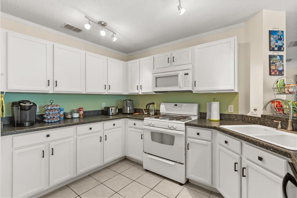 Bright and well-stocked kitchen — perfect for morning coffee or family dinners at home.