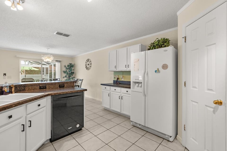 Light-filled kitchen with ample storage and modern appliances for a comfortable, homey stay.
