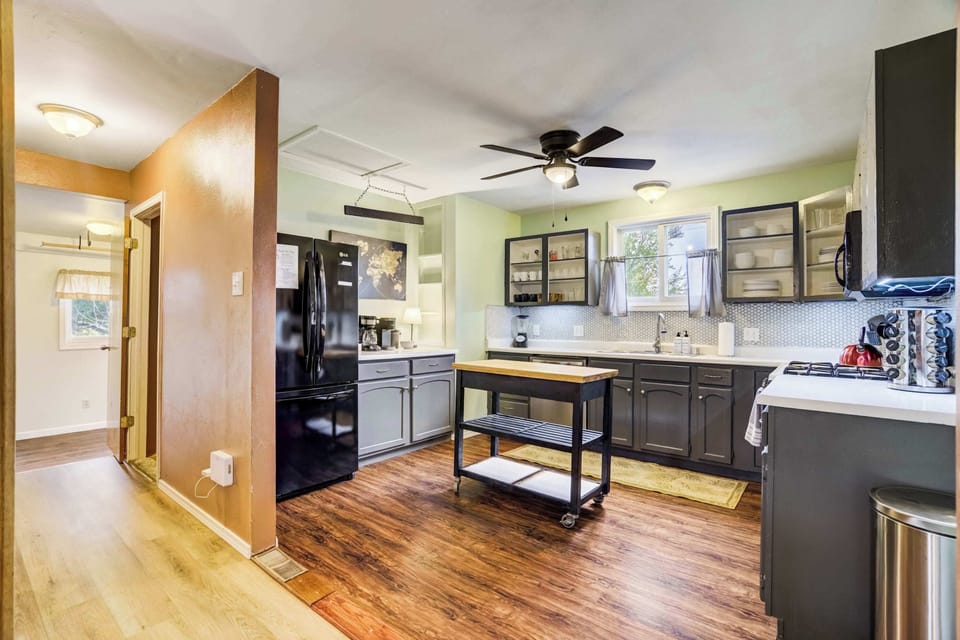 This well-equipped kitchen features stainless steel appliances, a center island, and plenty of space to gather. Everything you need for everyday cooking or a weekend dinner is right at your fingertips.