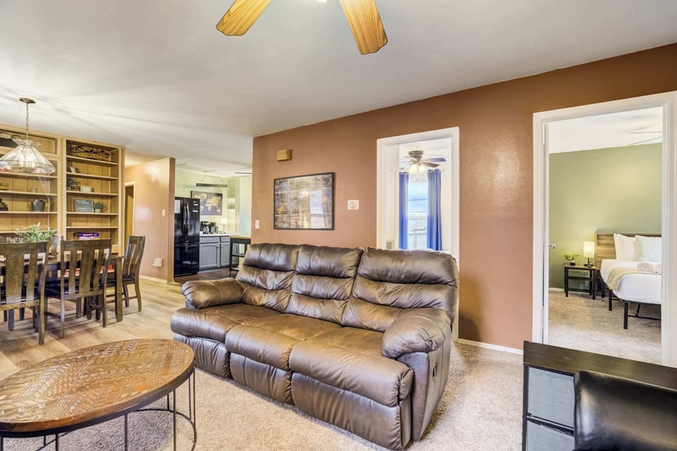 The open layout connects the living room to the kitchen and dining area for easy flow. It’s a great setup for entertaining or spending quality time together.