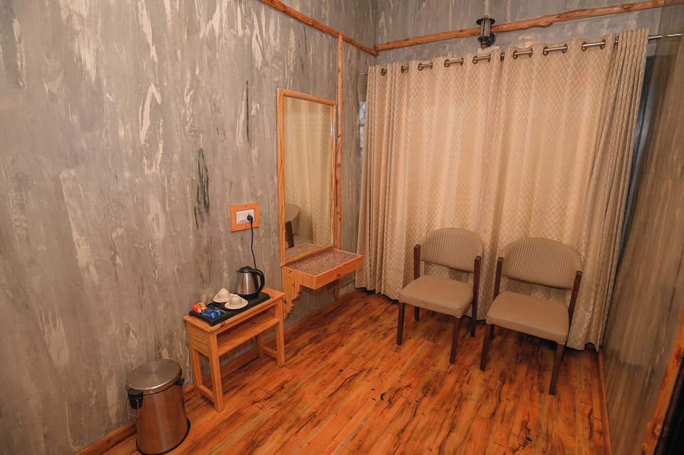 Junior Double Room, Garden View | Living area | TV