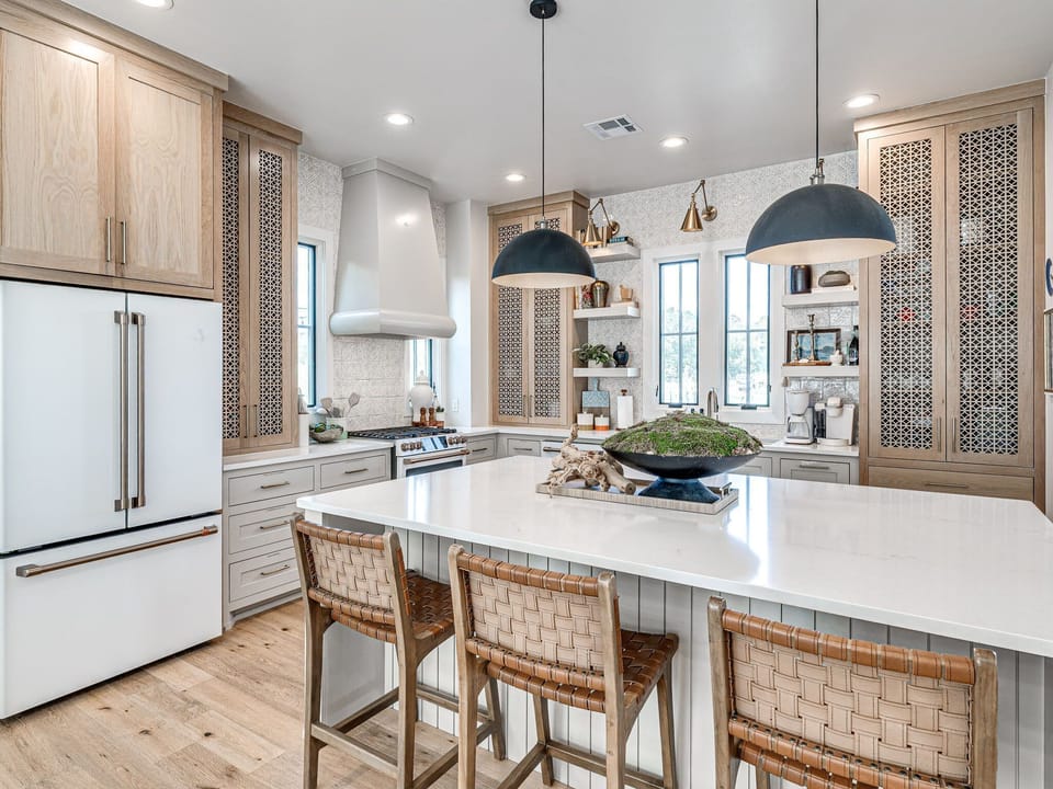 3. Expansive kitchen featuring Café appliances, double oven, farmhouse sink, and ample counter space — truly the heart of Hideaway 56.