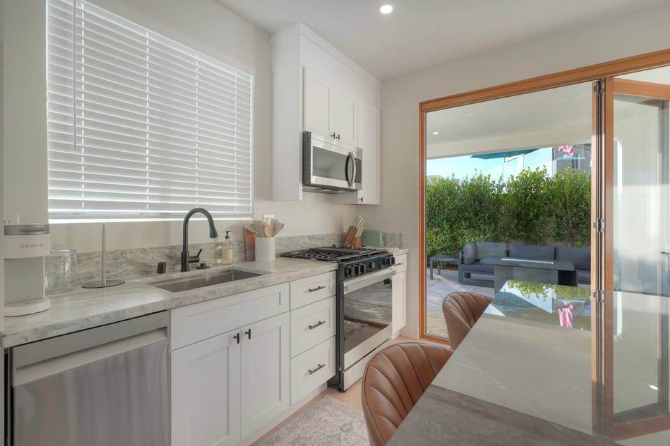 Modern kitchen with patio access and sunlight