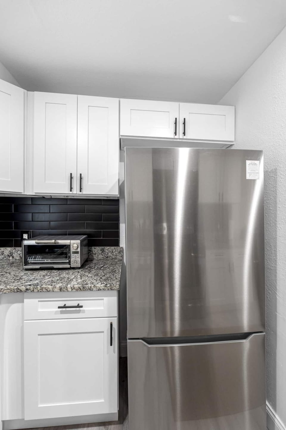 Cook and store with ease in a well-equipped kitchen that includes a Breville Toaster Oven and full-size refrigerator for all your meal prep and storage needs.