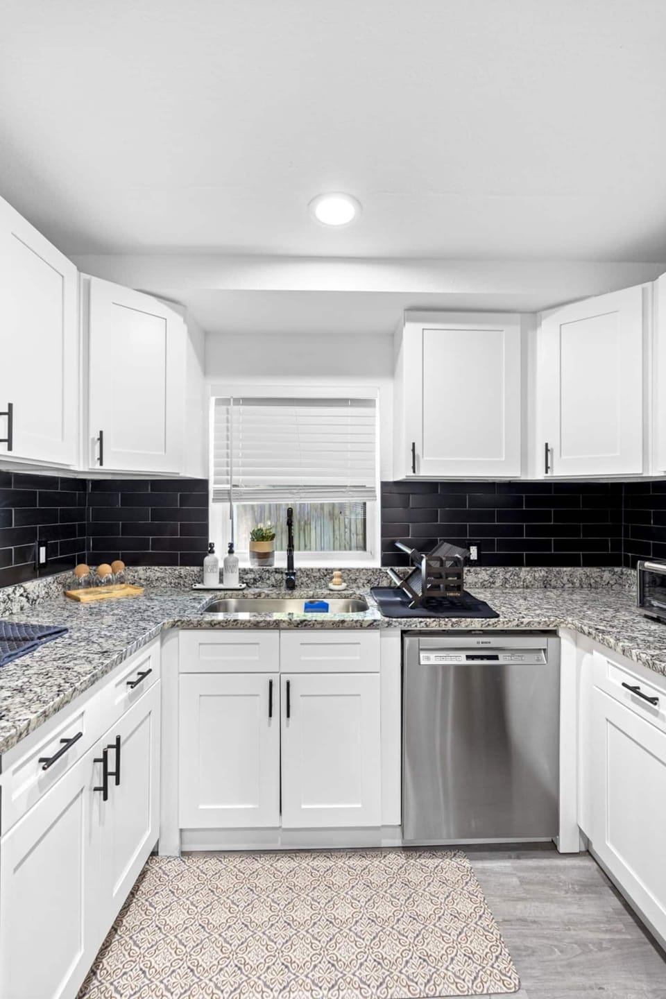 Experience an expansive kitchen countertop with ample prep space, ideal for meal prep, casual dining, and connecting with loved ones.