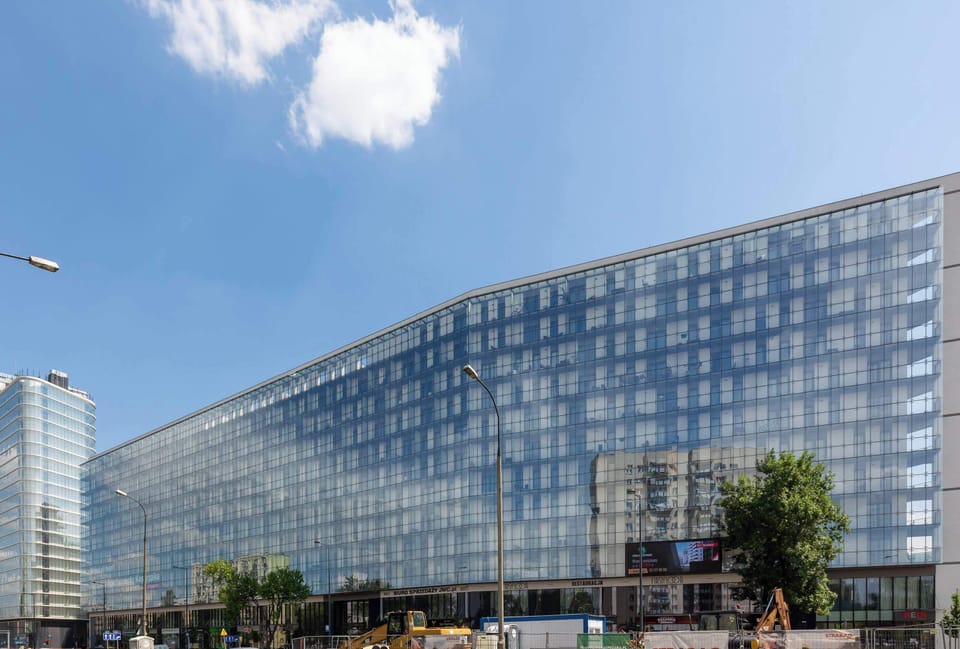 The modern structure with its sleek glass façade fits perfectly into the urban landscape, offering a stylish place to stay.
