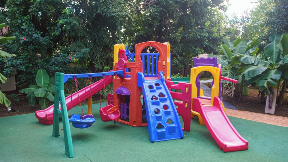 Let little ones play safely on the colorful playground.