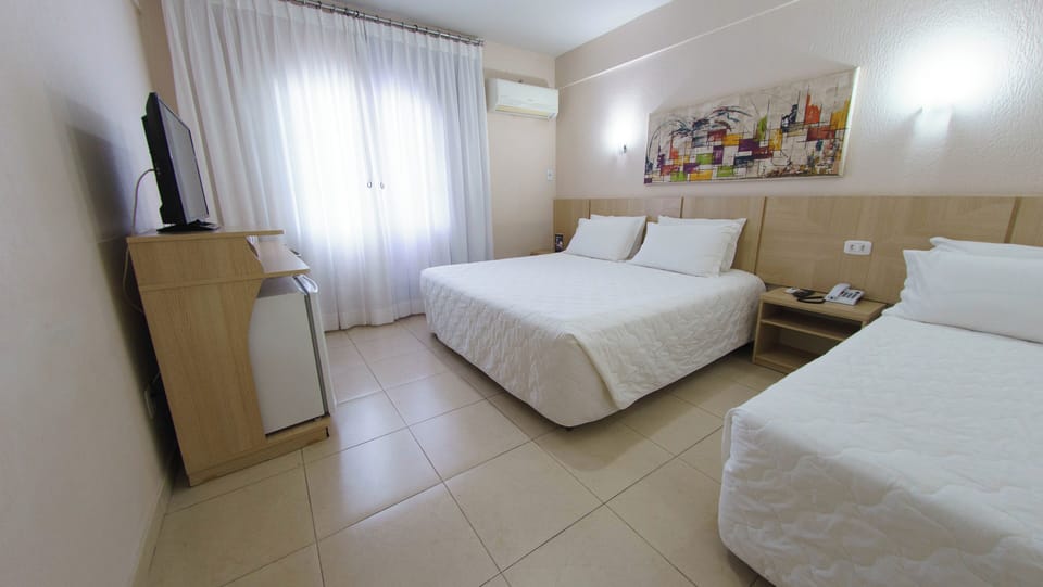 Settle into a spacious, airy room with cooling AC.