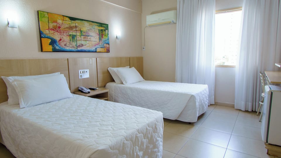 Wake up refreshed in bright twin beds, cool AC.