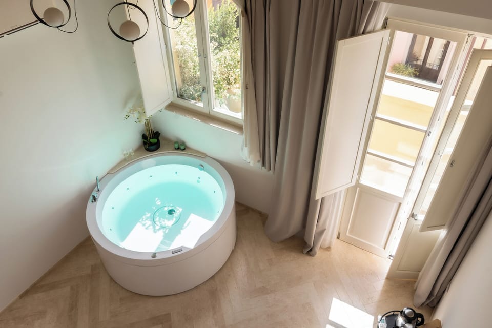 Superior Suite, Balcony, City View | Private spa tub