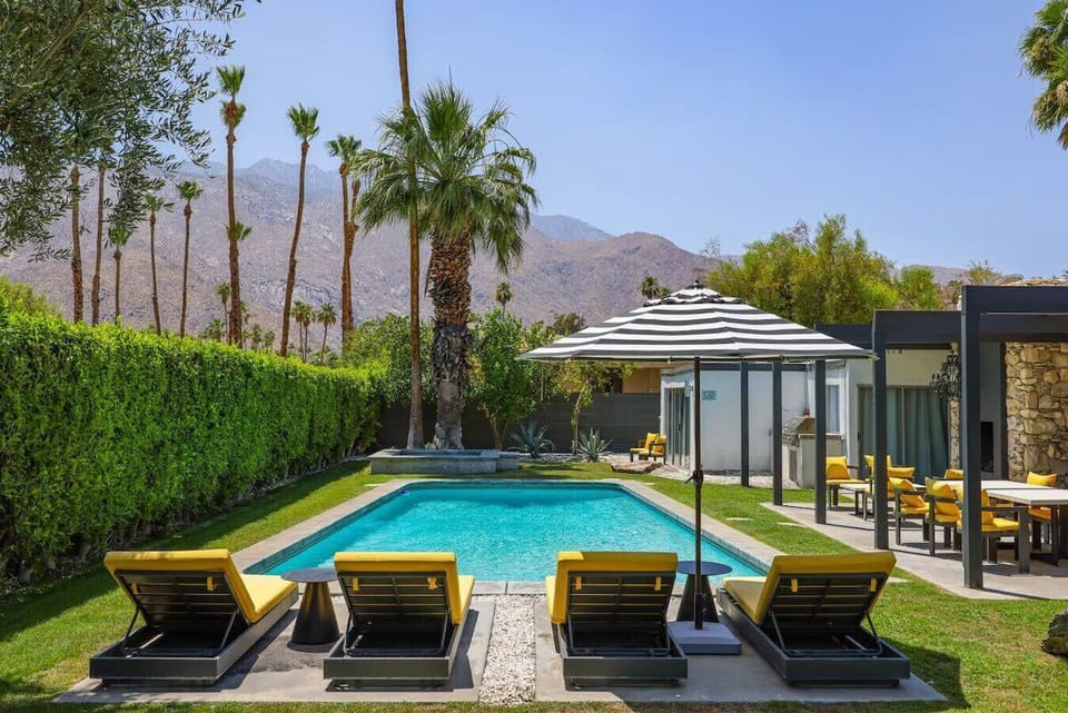 Escape to paradise. This outdoor pool is the perfect spot to unwind, relax, and leave your worries behind.
