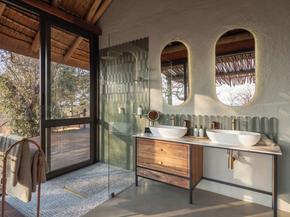 Separate tub and shower, hair dryer, slippers, towels