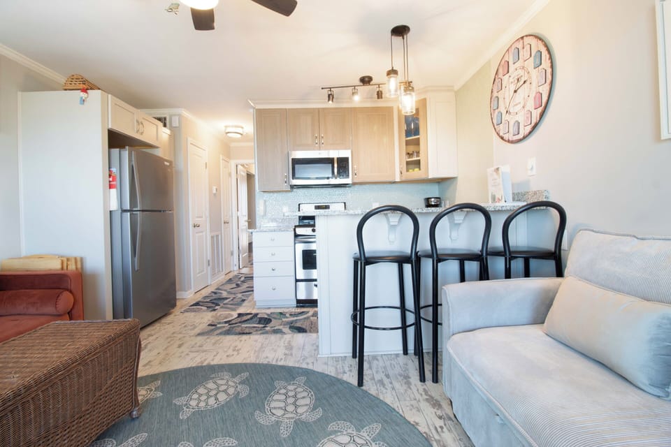 Relax in your bright, open-plan space where a fully equipped kitchen flows seamlessly into the cozy living area—perfect for cooking, dining, and unwinding together after a day of adventure.