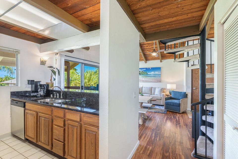 View from kitchen into living area, showing the seamless flow of the layout.