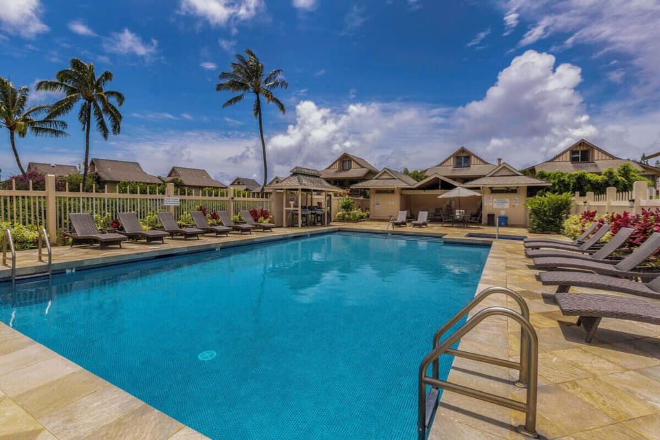 Soak in the sun and island breezes from one of the many loungers at the Sandpiper Village pool.