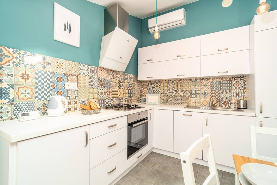 Fully Equipped Kitchen with Colorful Design and Modern Appliances | Book Now with RENTUJEMY.COM