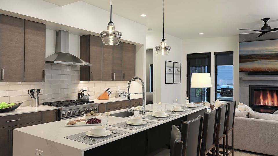 Kitchen, Main Level - Modern kitchen with oversized island seating and open layout to the great room