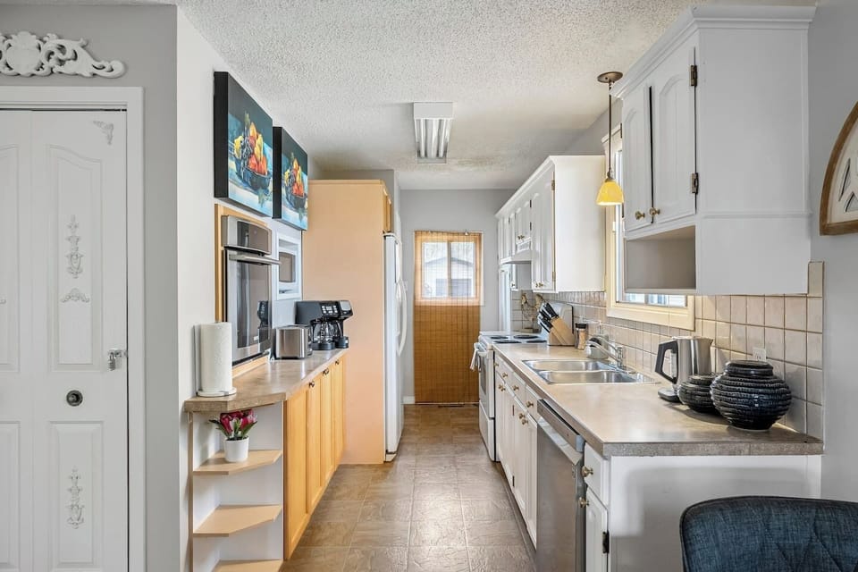 Full kitchen with a drip coffee machine, ground coffee, tea, sugar and basic condiments (ketchup, mustard and relish.)