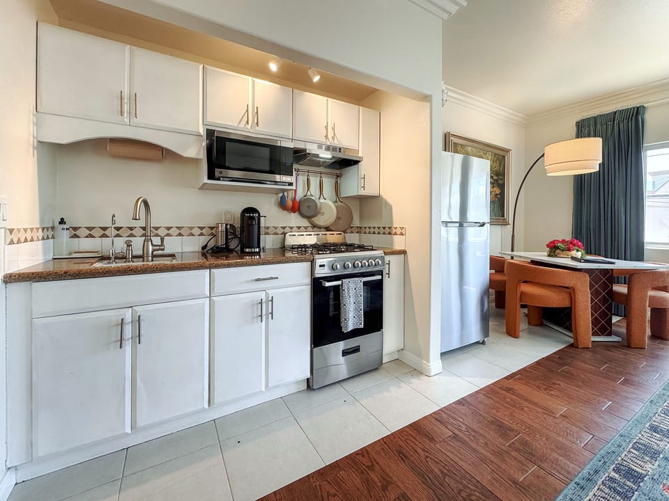 Bright full kitchen with cozy dining nook and modern essentials