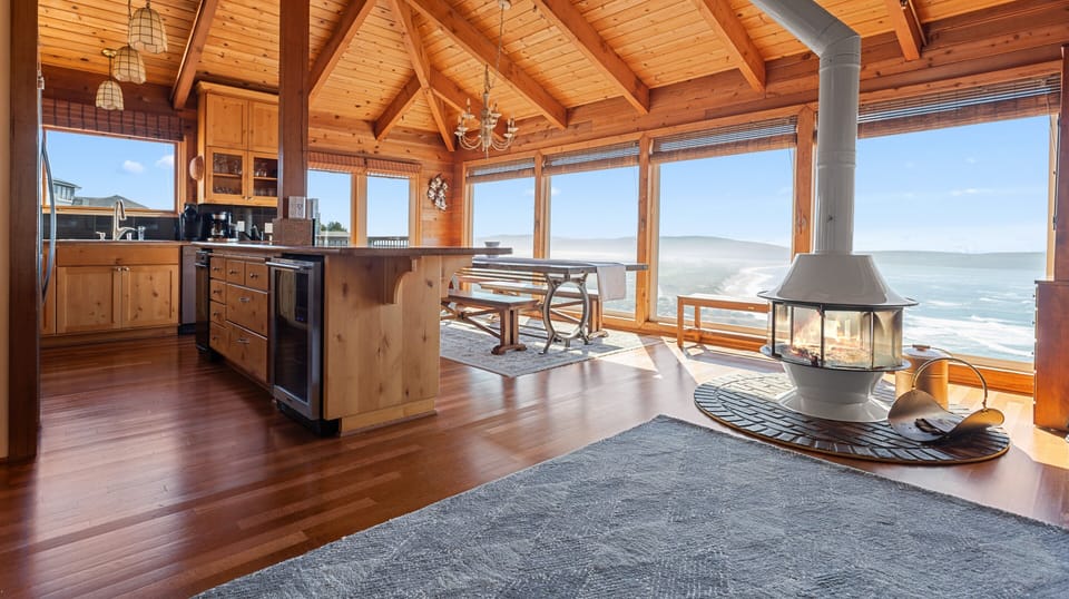 Large kitchen island with wine fridge.