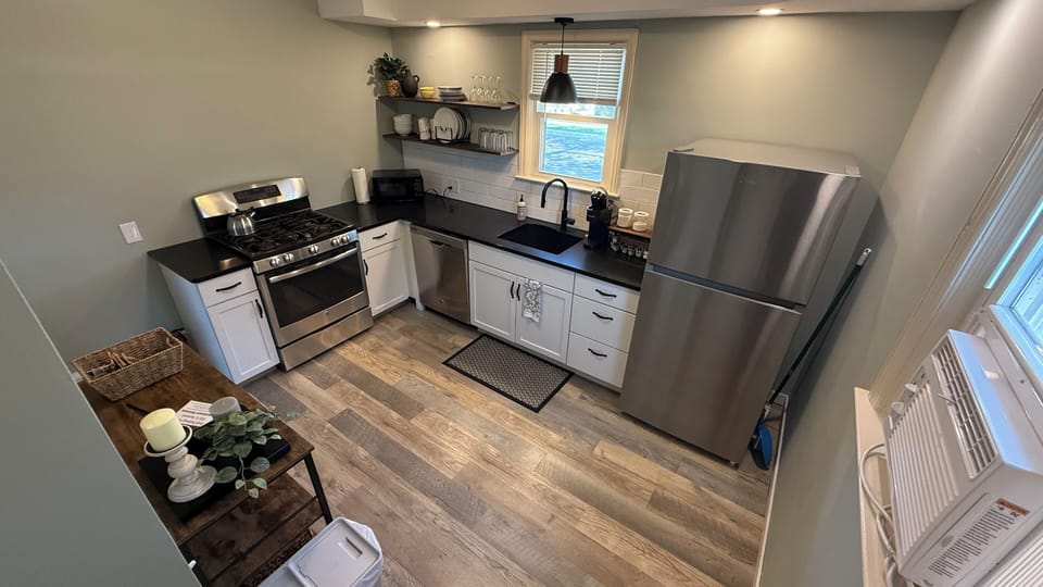 Fully equipped kitchen with a Keurig, starter pods, cream & sugar and tea.