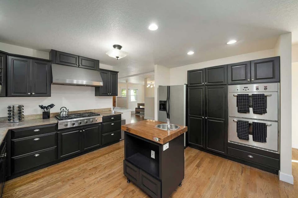 Kitchen with large island and double ovens.