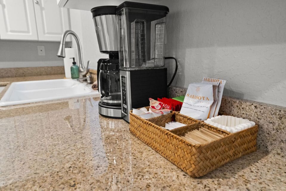 Good morning! This coffee station comes complete with a drip filter coffee maker and a basket of coffee and tea essentials, perfect for starting your day just the way you like it!