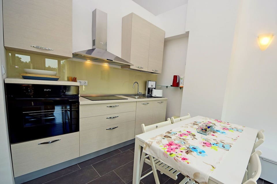 Cabinetry, Furniture, Countertop, Kitchen Appliance, Kitchen Stove, Drawer, Interior Design, Home Appliance, Table, Kitchen