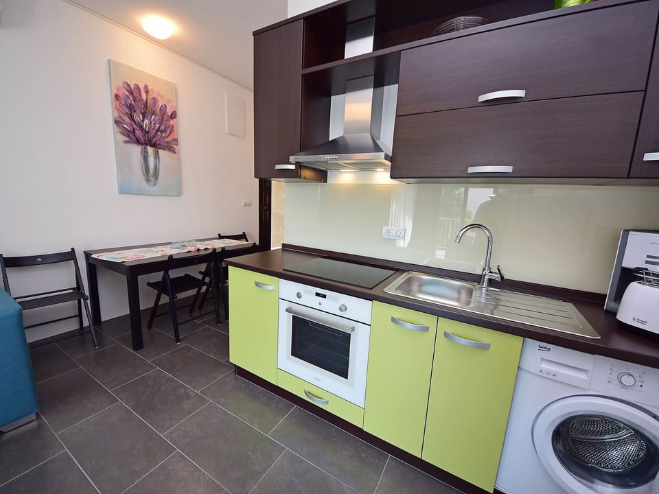 Laundry Room, Cabinetry, Property, Furniture, Countertop, Tap, Sink, Kitchen Stove, Kitchen Sink, Clothes Dryer
