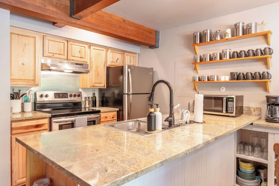 Kitchen: Stocked with amenities, spices, and cookware. 