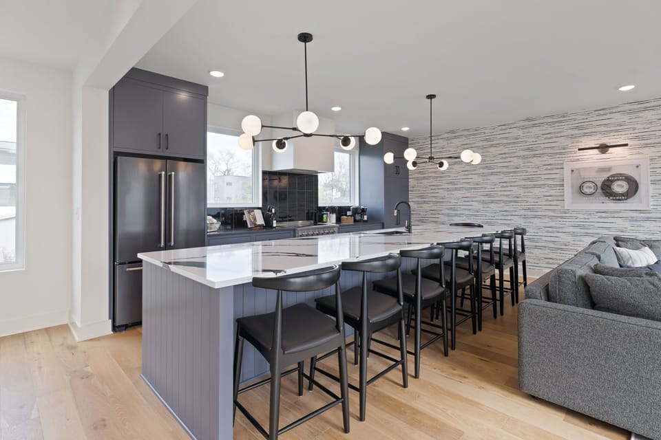 Open-concept kitchen and dining space with ample seating — perfect for group meals.