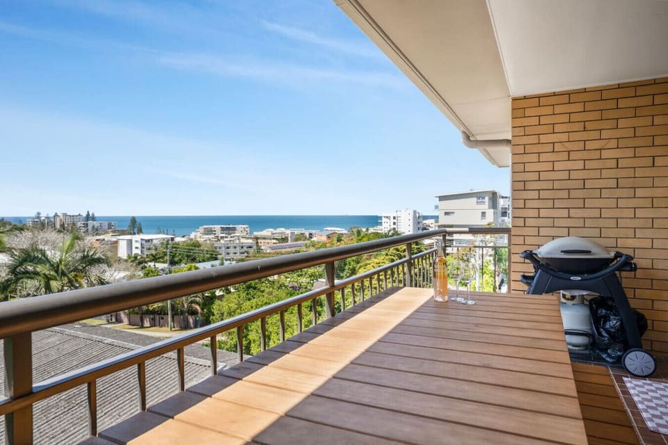 Balcony with outdoor dining and BBQ