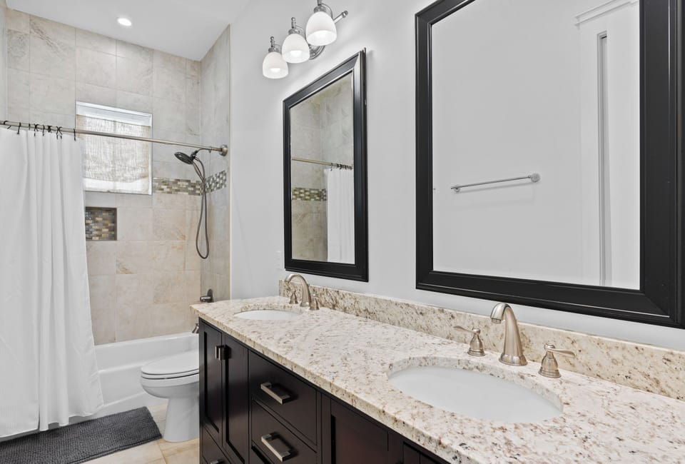 Full bathroom features a shower/tub combo.