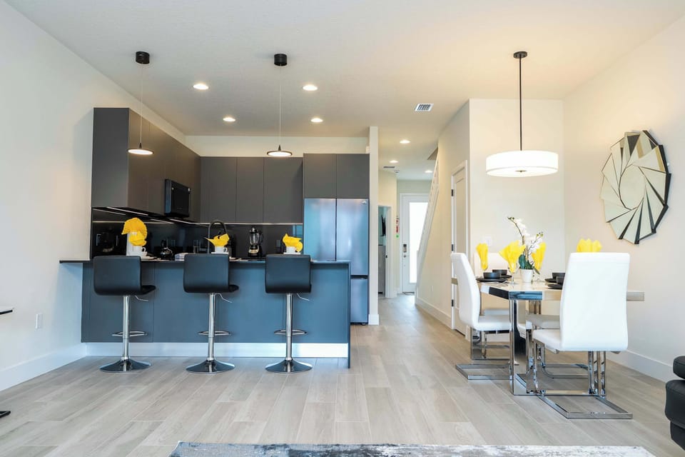 Experience the open-concept design of our Serenity home. The flow from the gourmet kitchen to the dining area makes it easy for the whole family to stay connected.