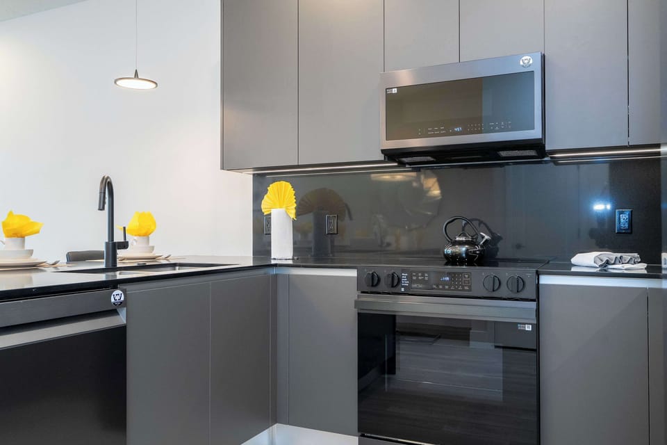 Our bright and airy living space is designed for comfort. Enjoy the large flat-screen TV and modern decor that makes this 3-bedroom retreat feel like home.