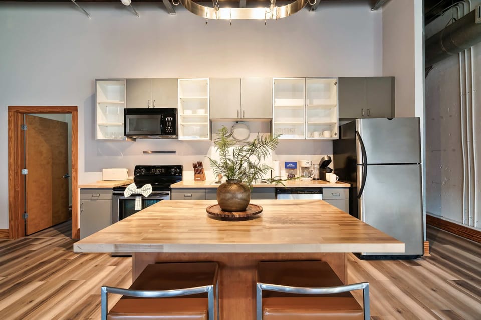 Your Modern Kitchen is waiting! Bright, open space with sleek appliances and inviting dining area for culinary adventures!