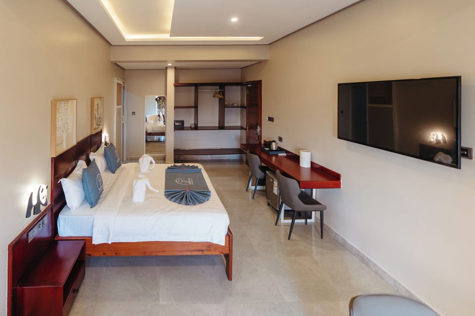 Comfort Suite, Balcony, City View | In-room safe, desk, laptop workspace, blackout drapes