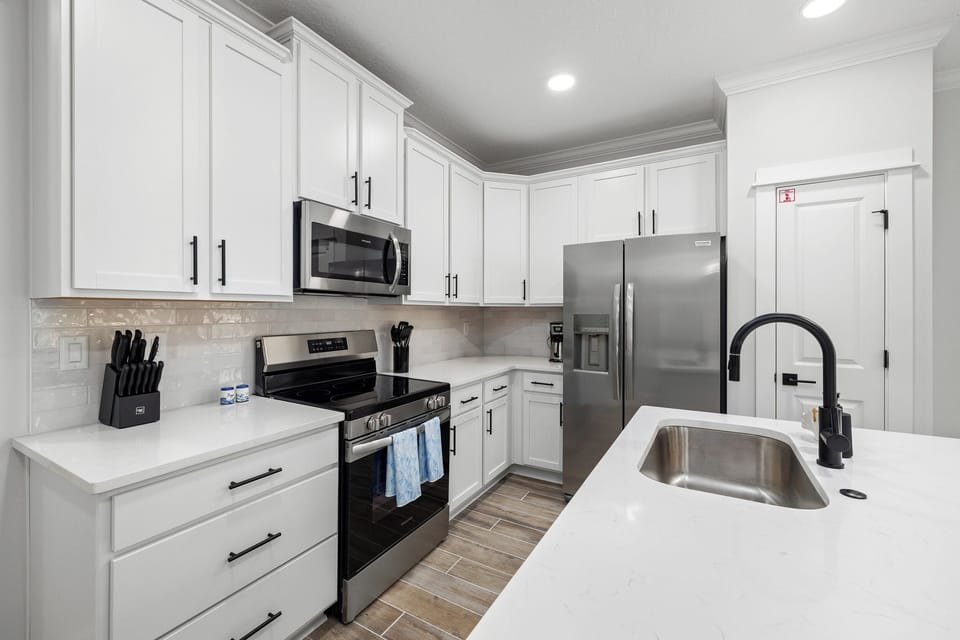 Fully equipped kitchen with modern appliances and ample space