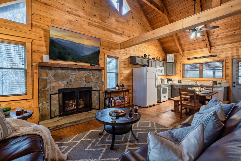 Open living room with 65" tv and gas fireplace 