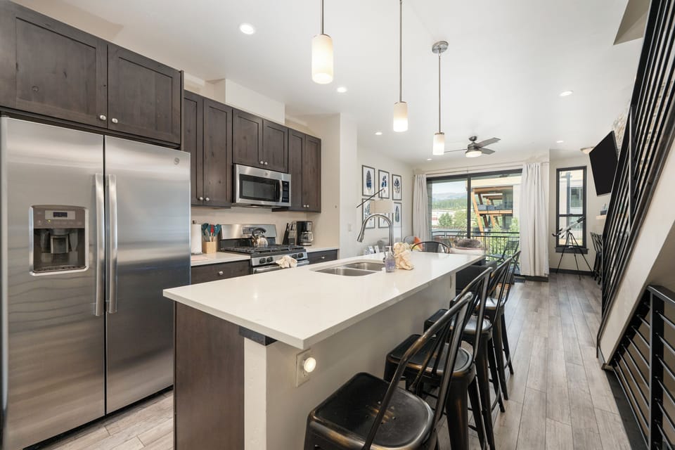 Your modern kitchen awaits with sleek granite counters, stainless appliances, and a spacious island perfect for cooking memorable meals together.