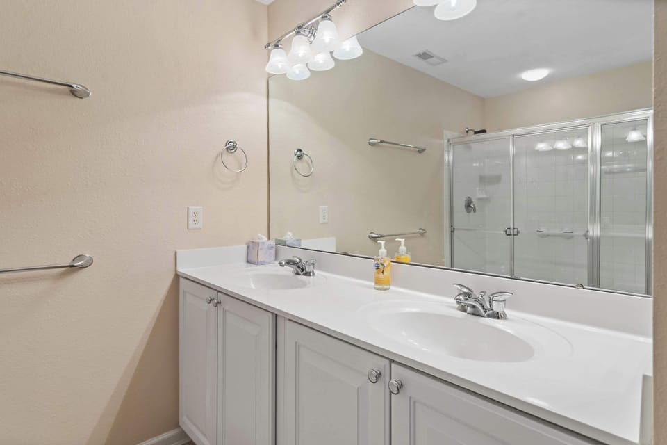A double vanity, shower, & soaking tub await in the king ensuite​
