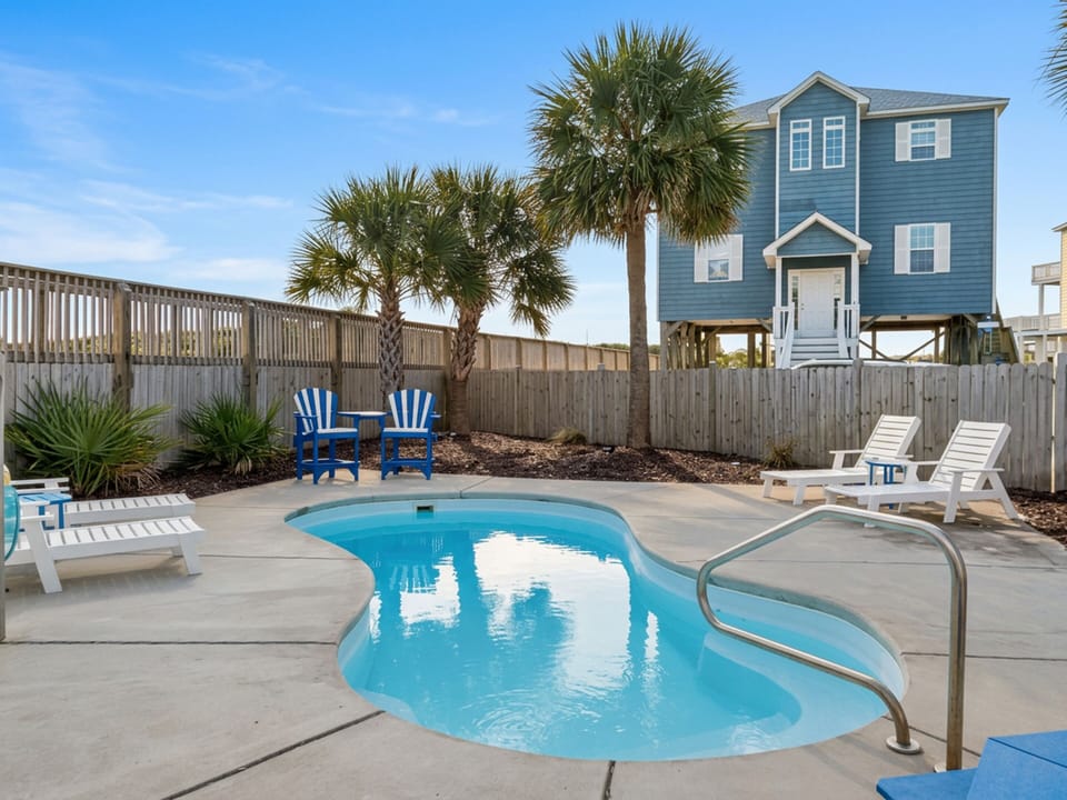 Sparkling Pool with Outdoor Dining + Lounge Areas