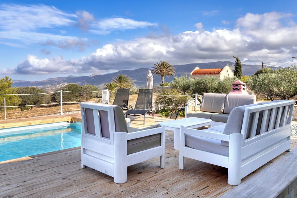 Outdoor space with spectacular views,  swimming pool, sun beds and sitting areas