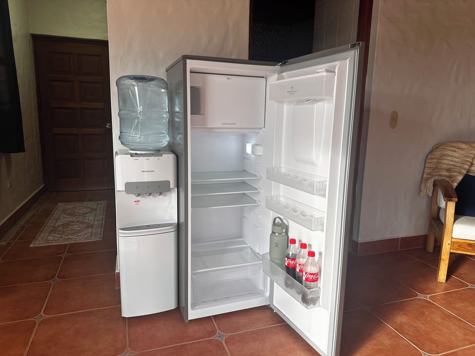 Full refrigerator with freezer box, water dispenser with hot and cold options