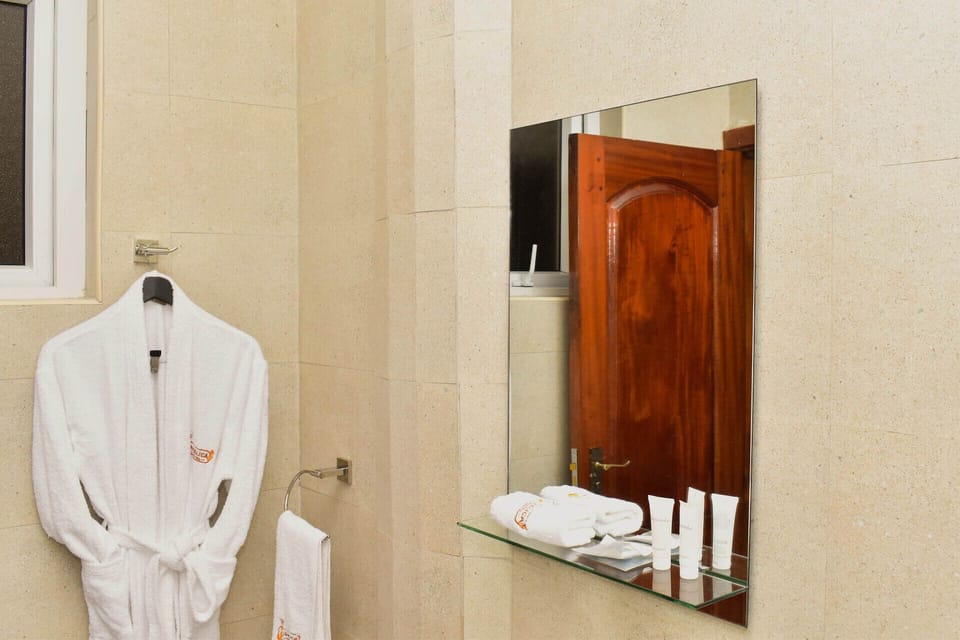 Standard Double Room, City View | Bathroom | Shower, slippers, towels, soap